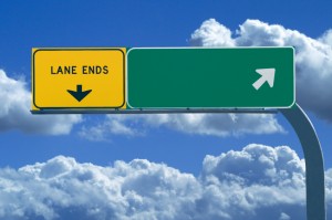 Blank freeway sign in blue cloudy skies